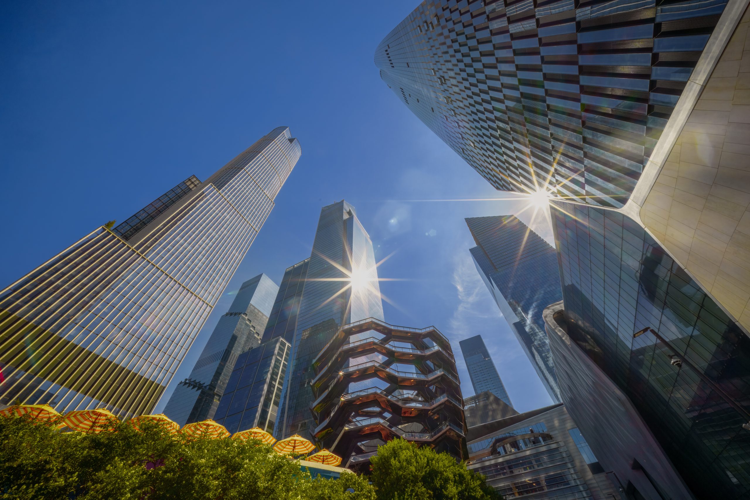 Upward view of Hudson Yards skyscrapers and the Vessel sculpture in New York City