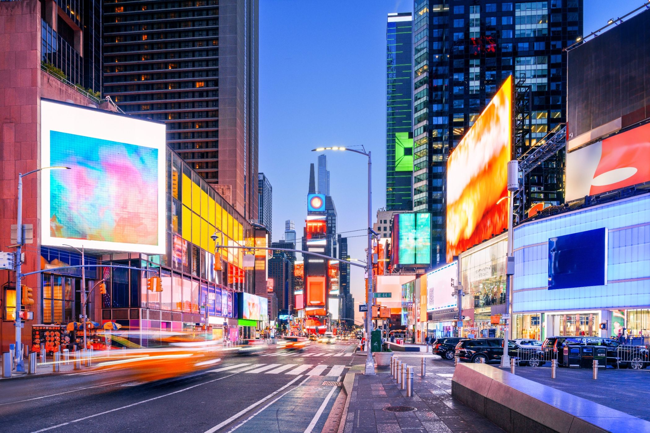 Aerial view of Times Square at night with illuminated billboards in New York City